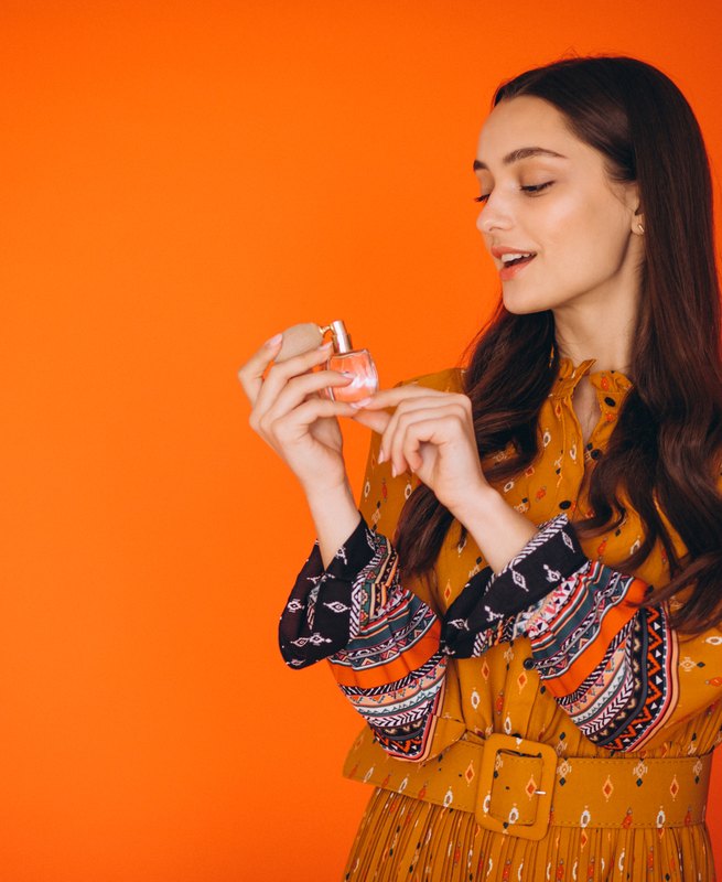 A woman enjoying her favourite Arabian fragrance